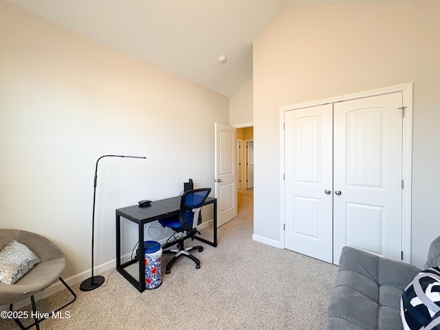 office area featuring high vaulted ceiling, baseboards, and carpet