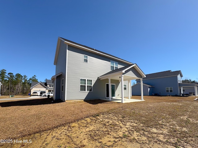 back of property with a patio area
