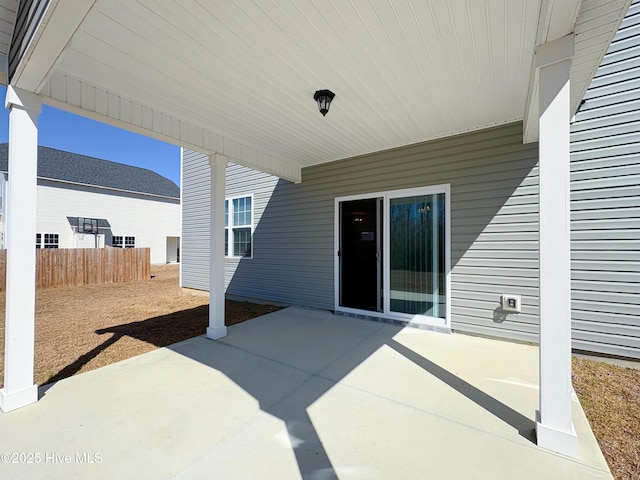 view of patio / terrace featuring fence