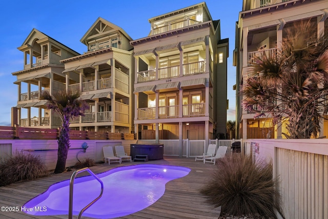 exterior space with a fenced in pool and fence