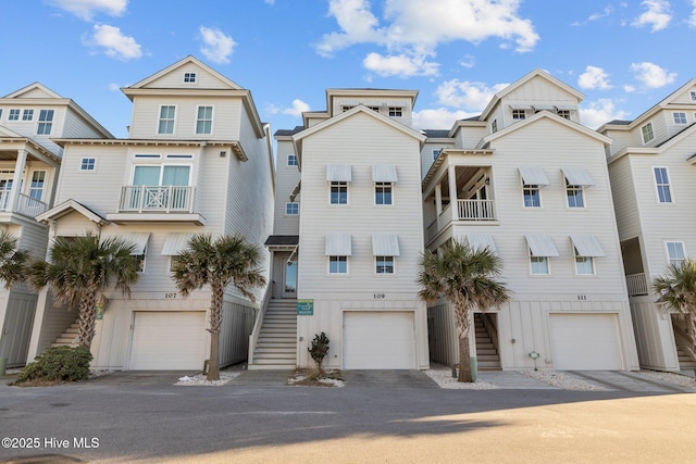 view of front of home featuring stairway and an attached garage