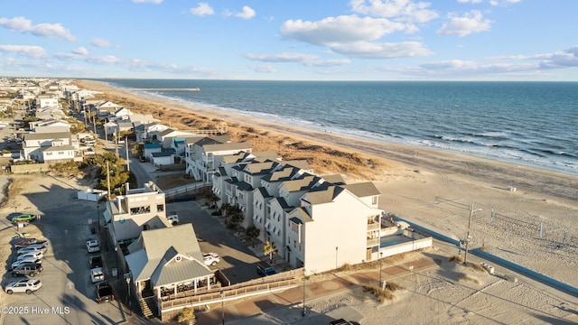 aerial view featuring a beach view, a residential view, and a water view