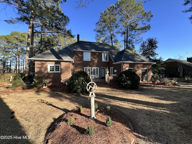 view of front of house with brick siding