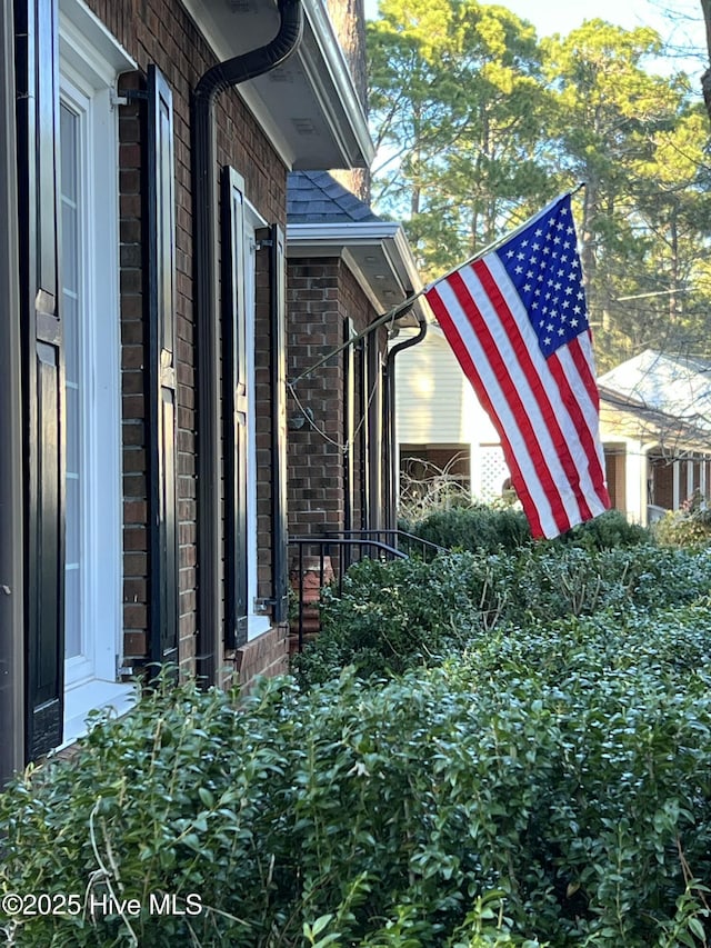 view of home's exterior featuring brick siding