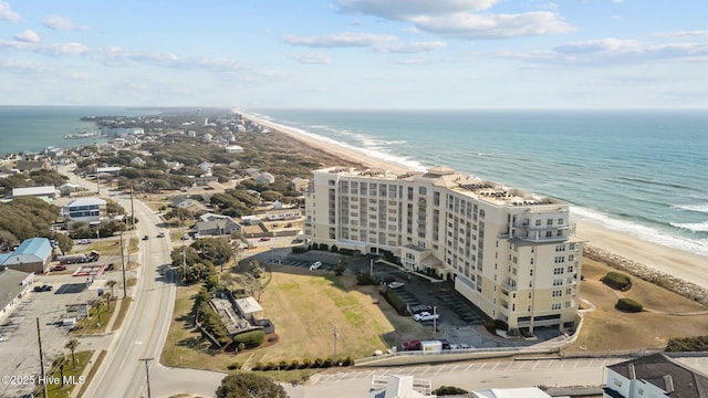 bird's eye view with a water view and a view of the beach