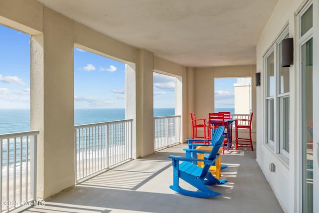 balcony featuring a water view