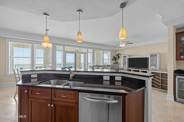 kitchen featuring open floor plan, stainless steel dishwasher, a sink, and a wealth of natural light