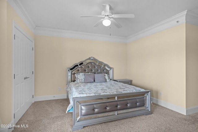 bedroom with carpet floors, crown molding, baseboards, and a ceiling fan