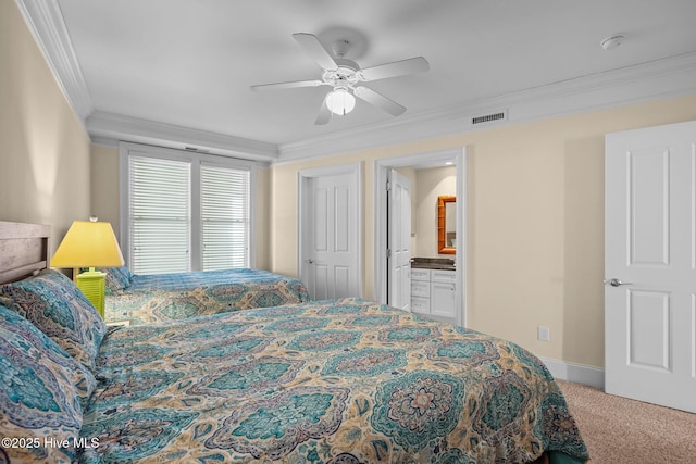 carpeted bedroom with ceiling fan, connected bathroom, visible vents, and crown molding