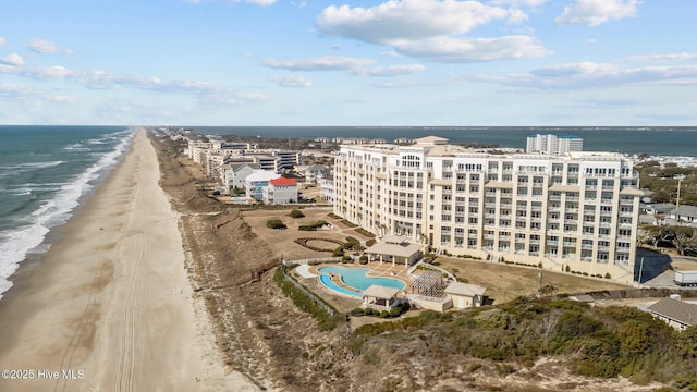 bird's eye view with a water view and a view of the beach