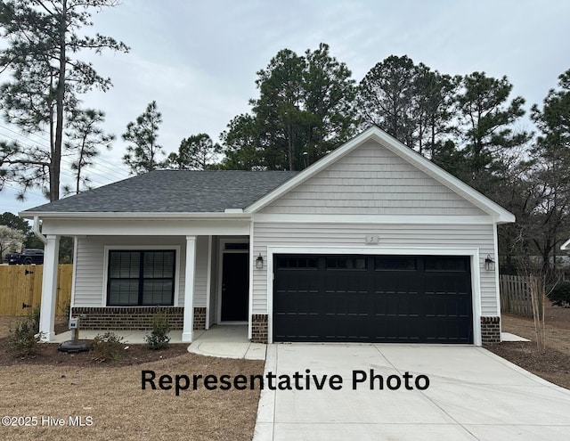 single story home featuring brick siding, fence, driveway, and an attached garage