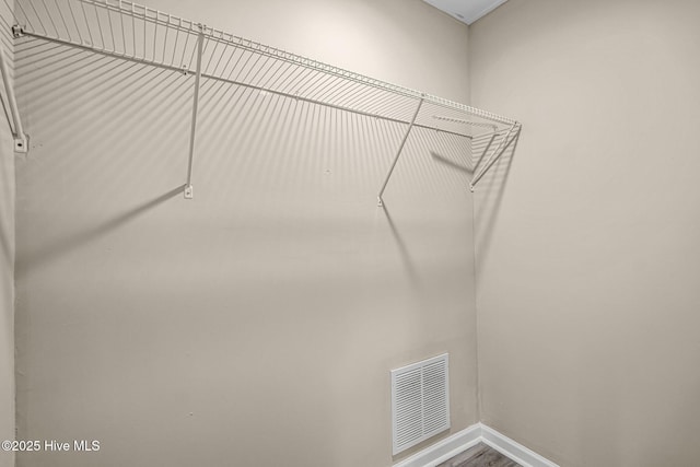 walk in closet with visible vents