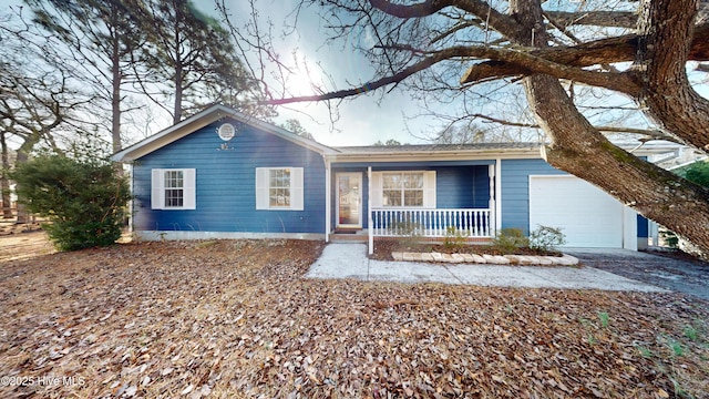 ranch-style house with covered porch and an attached garage