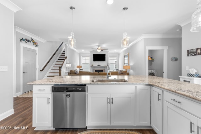 172 Everett Park Trl, Holly Ridge, NC 28445 - kitchen featuring stainless steel dishwasher, a sink, a fireplace, a ceiling fan, and washer / clothes dryer