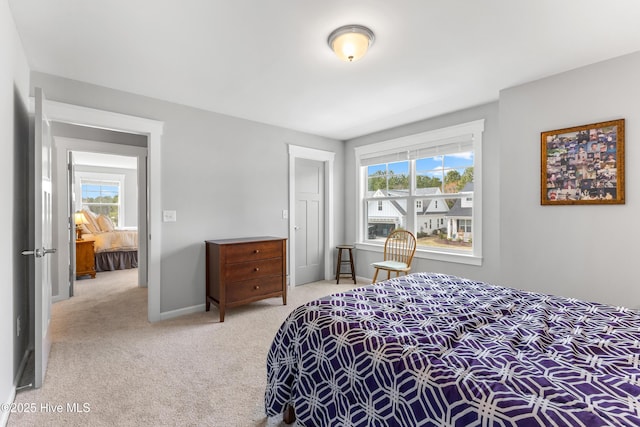 172 Everett Park Trl, Holly Ridge, NC 28445 - bedroom featuring multiple windows, carpet floors, and baseboards