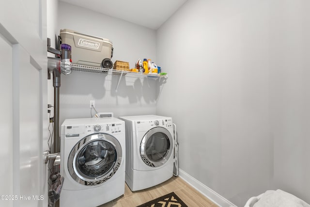 172 Everett Park Trl, Holly Ridge, NC 28445 - washroom with separate washer and dryer, light wood-style floors, and baseboards