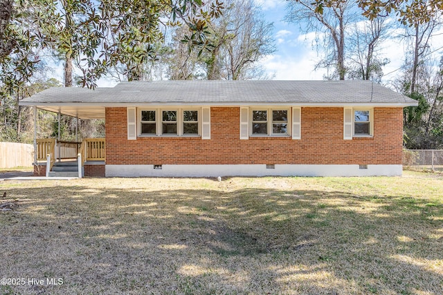 view of front of property with crawl space, fence, a front lawn, and brick siding