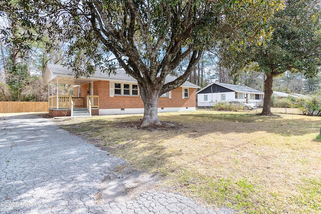 single story home with brick siding, a porch, crawl space, fence, and a front lawn