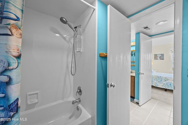 ensuite bathroom with tile patterned flooring, visible vents, shower / washtub combination, and connected bathroom