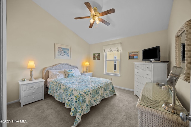 carpeted bedroom featuring vaulted ceiling, a ceiling fan, and baseboards