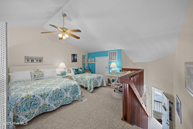 carpeted bedroom with lofted ceiling, visible vents, and a ceiling fan