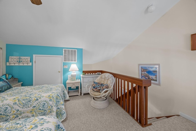 bedroom featuring carpet, visible vents, and lofted ceiling