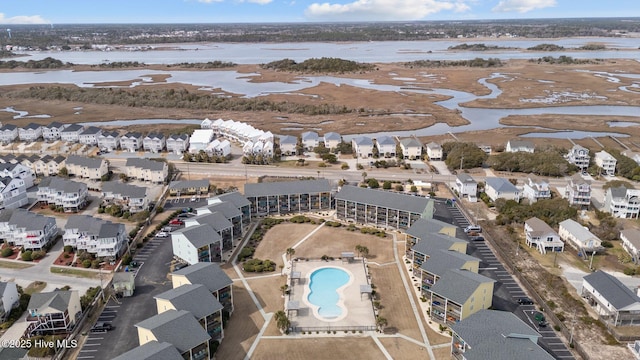 bird's eye view featuring a residential view and a water view