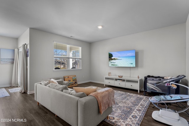 living room with wood finished floors and baseboards