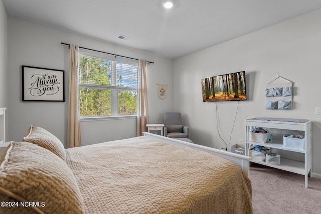 bedroom featuring carpet floors and visible vents