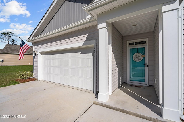 garage with concrete driveway