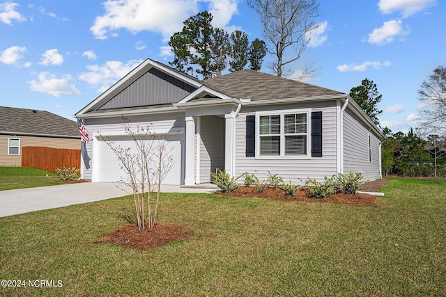 view of front of house featuring concrete driveway, an attached garage, fence, and a front yard