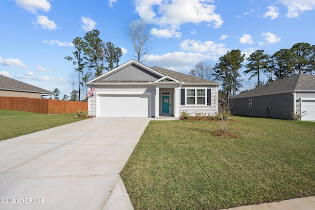 ranch-style house with an attached garage, fence, concrete driveway, and a front yard