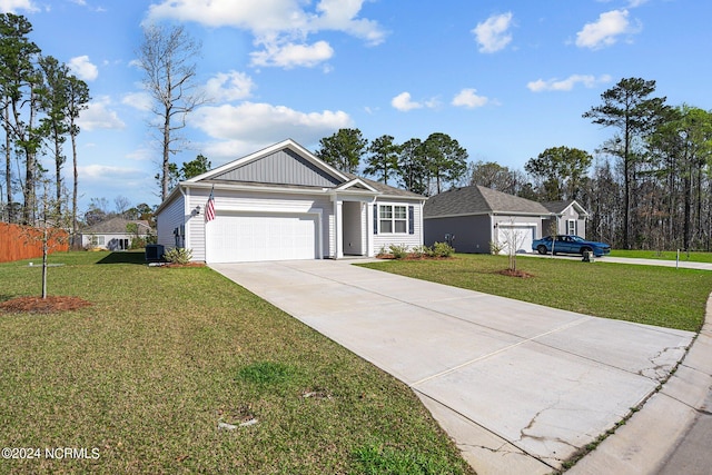 ranch-style home with an attached garage, cooling unit, driveway, a front lawn, and board and batten siding