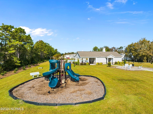 communal playground with a lawn and a patio