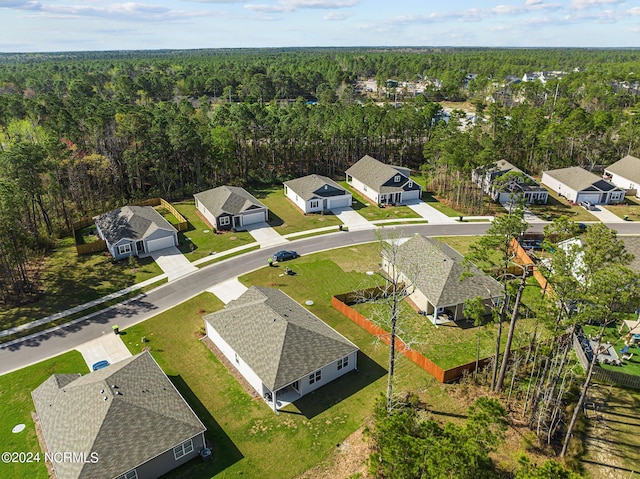 bird's eye view with a residential view and a view of trees