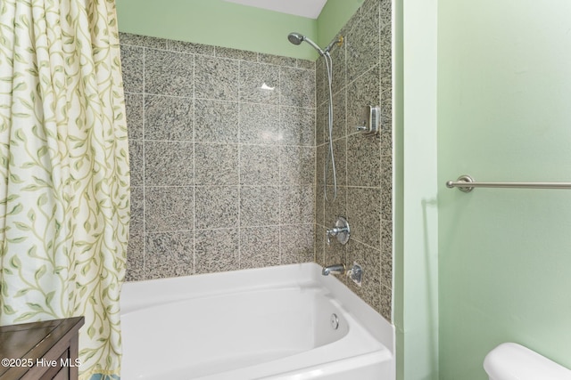 full bath with toilet and shower / bath combination with curtain