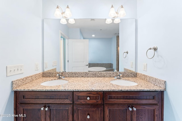 full bathroom with double vanity and a sink