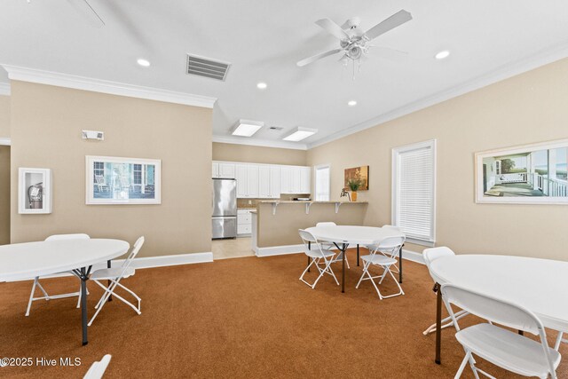 dining area with crown molding, recessed lighting, visible vents, light carpet, and baseboards