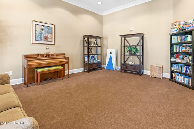 living area with ornamental molding, carpet flooring, and baseboards