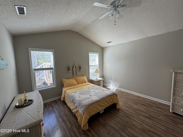 bedroom featuring multiple windows, wood finished floors, and visible vents