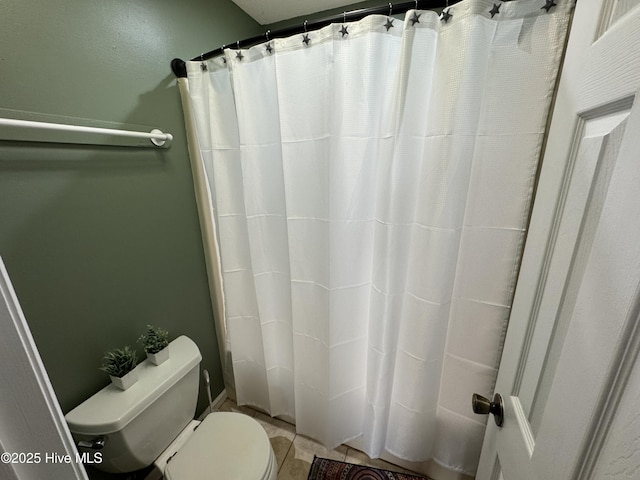 full bath with a shower with shower curtain and toilet