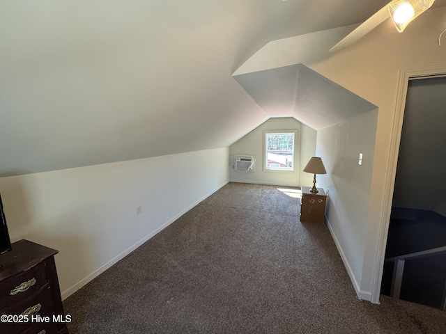 bonus room with lofted ceiling, baseboards, carpet floors, and an AC wall unit