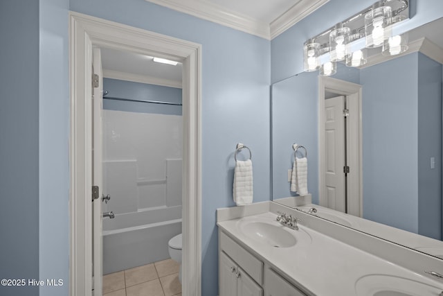 bathroom featuring double vanity, toilet, ornamental molding, tile patterned floors, and a sink