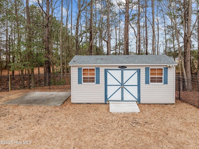 view of shed featuring a fenced backyard