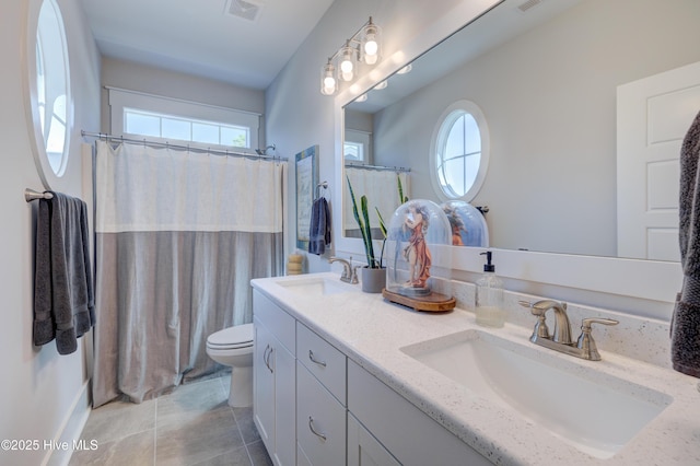 full bathroom with plenty of natural light, a sink, and visible vents