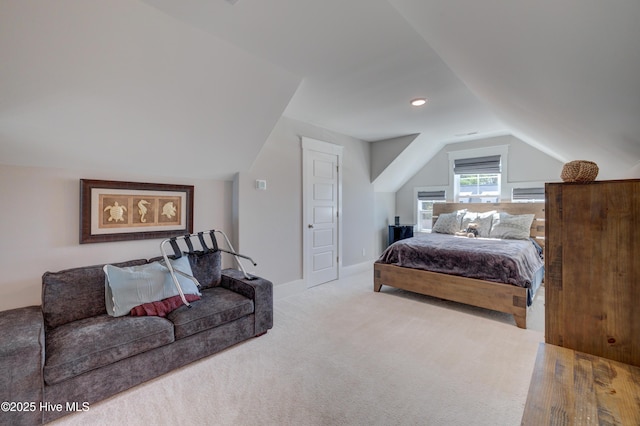 bedroom featuring lofted ceiling, carpet flooring, and baseboards