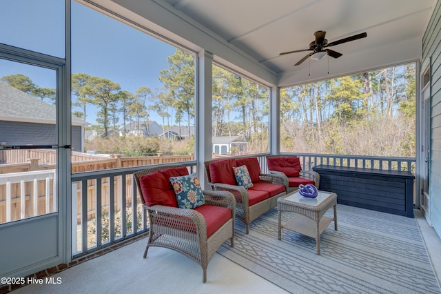 sunroom featuring ceiling fan