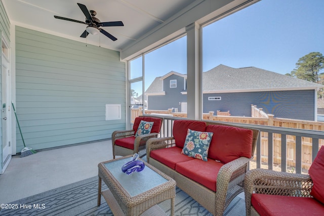 deck with outdoor lounge area and a ceiling fan