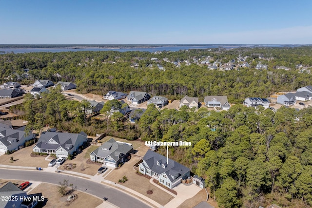 aerial view with a residential view and a view of trees