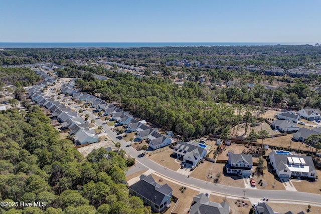 aerial view with a forest view and a residential view